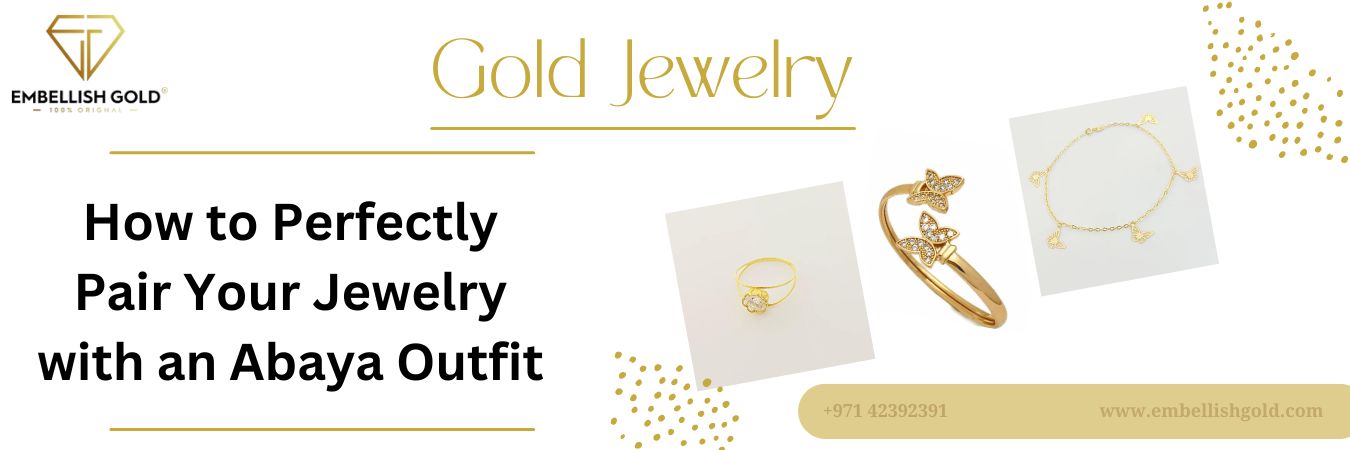 Gold jewelry set with ring, butterfly bracelet, and delicate chain styled for abaya outfit pairing