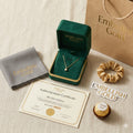 18k gold necklace with diamond pendant in green jewelry box, certificate, cloth, and gift bag