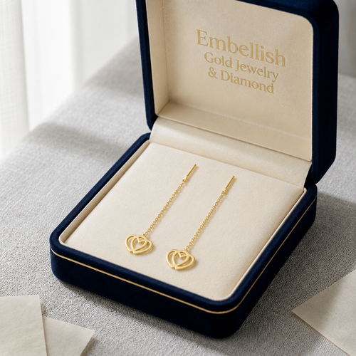 Gold heart-shaped necklace in an open jewelry box with 'Embellish Gold Jewelry & Diamond' branding.