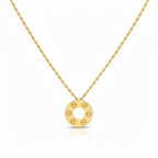 Gold necklace with a circular pendant on a white background