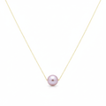 Necklace with a single pink pearl on a white background