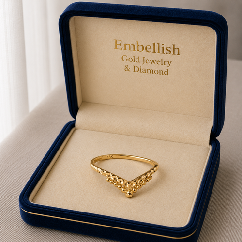 Gold ring in an open jewelry box with 'Embellish Gold Jewelry & Diamond' branding.