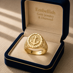 Gold ring with intricate design in a 'Embellish Gold Jewelry & Diamond' box.