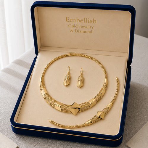 Gold jewelry set with necklace and earrings in a 'Embellish Gold Jewelry & Diamond' box.