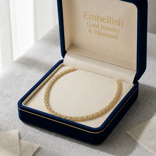 Gold necklace in a 'Embellish Gold Jewelry & Diamond' box on a light background