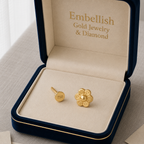 Gold earrings in a 'Embellish Gold Jewelry & Diamond' box on a light background