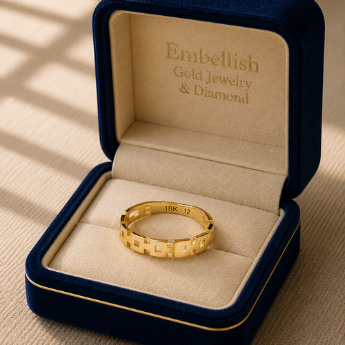 Gold ring in a 'Embellish Gold Jewelry & Diamond' box on a beige background