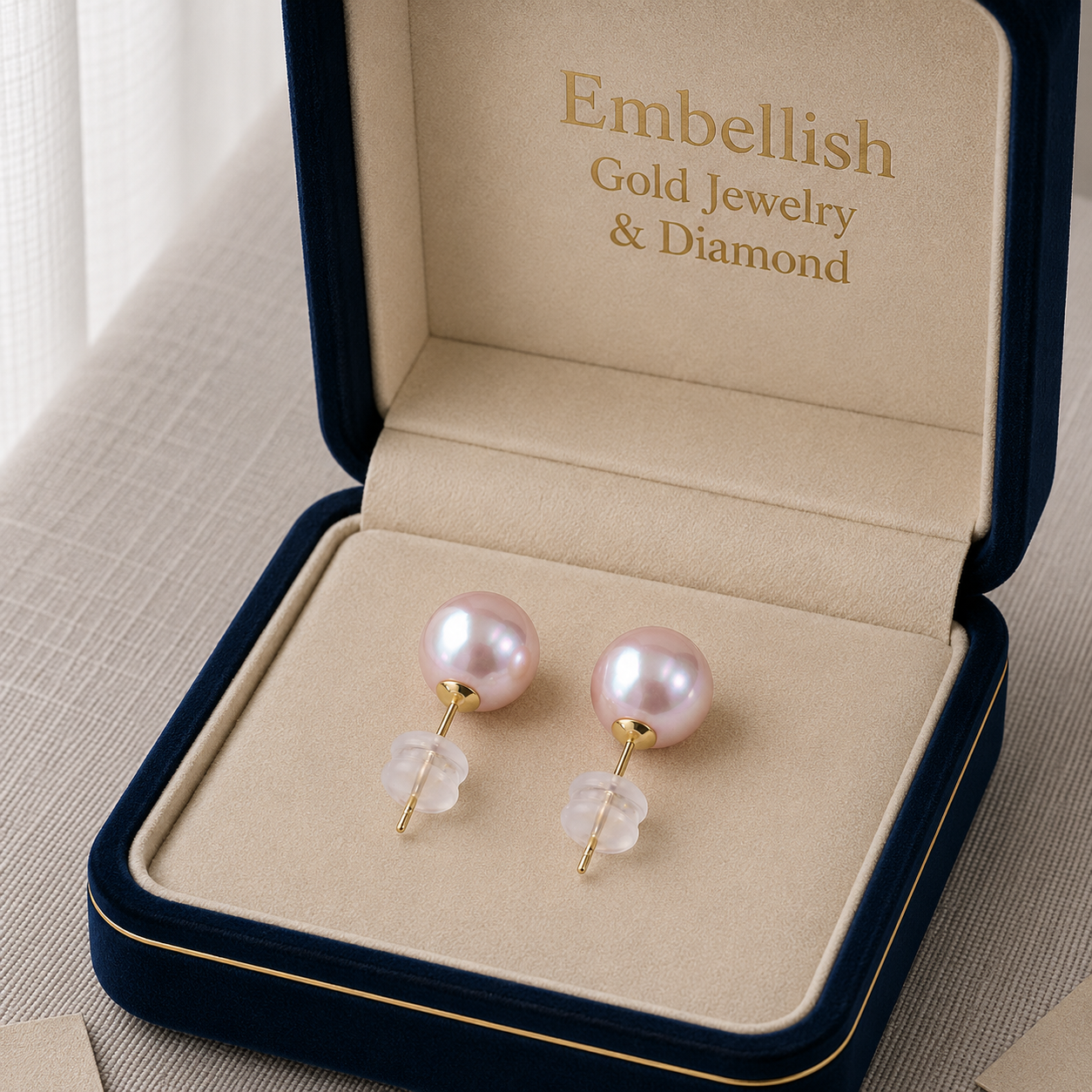 Pearl earrings in a 'Embellish Gold Jewelry & Diamond' box.