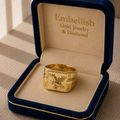 Gold ring with eagle design in a 'Embellish Gold Jewelry & Diamond' box.