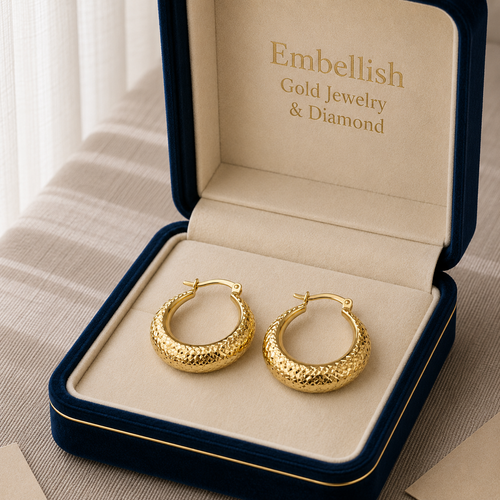 Gold hoop earrings in a 'Embellish Gold Jewelry & Diamond' box.