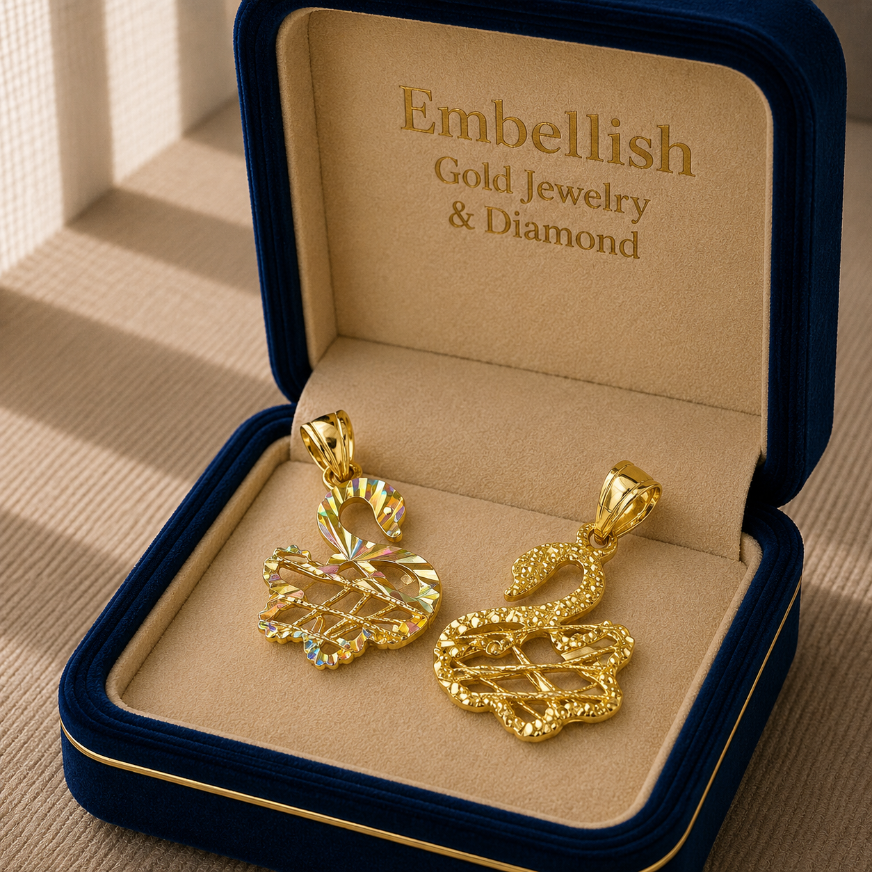 Gold jewelry set in a 'Embellish' box on a textured surface