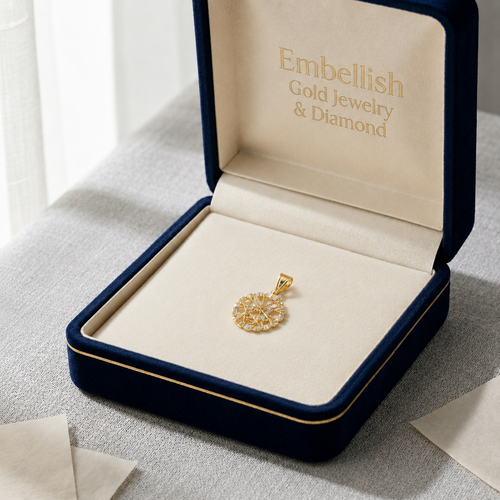 Gold pendant in an open jewelry box with 'Embellish Gold Jewelry & Diamond' branding.