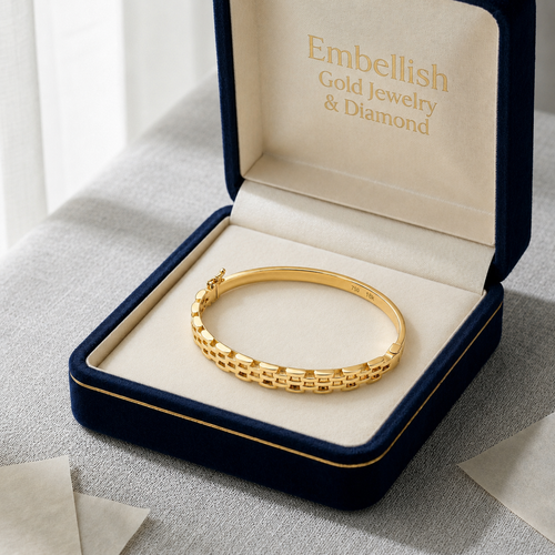Gold bracelet in an open jewelry box with 'Embellish Gold Jewelry & Diamond' branding.