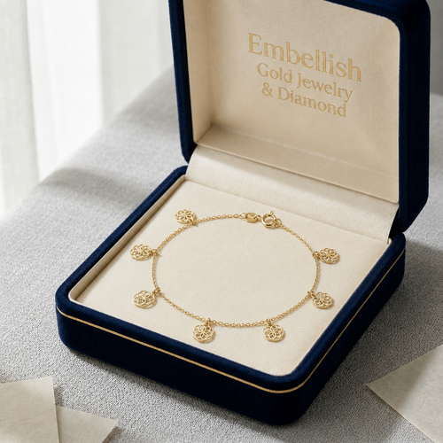 Gold bracelet in an open jewelry box with 'Embellish Gold Jewelry & Diamond' branding.