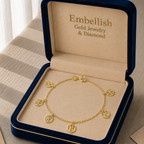 Gold bracelet with charms in an 'Embellish' jewelry box