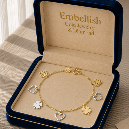 Gold bracelet with charms in an 'Embellish' jewelry box