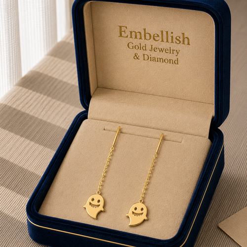 Gold ghost-shaped earrings in a 'Embellish Gold Jewelry & Diamond' box.