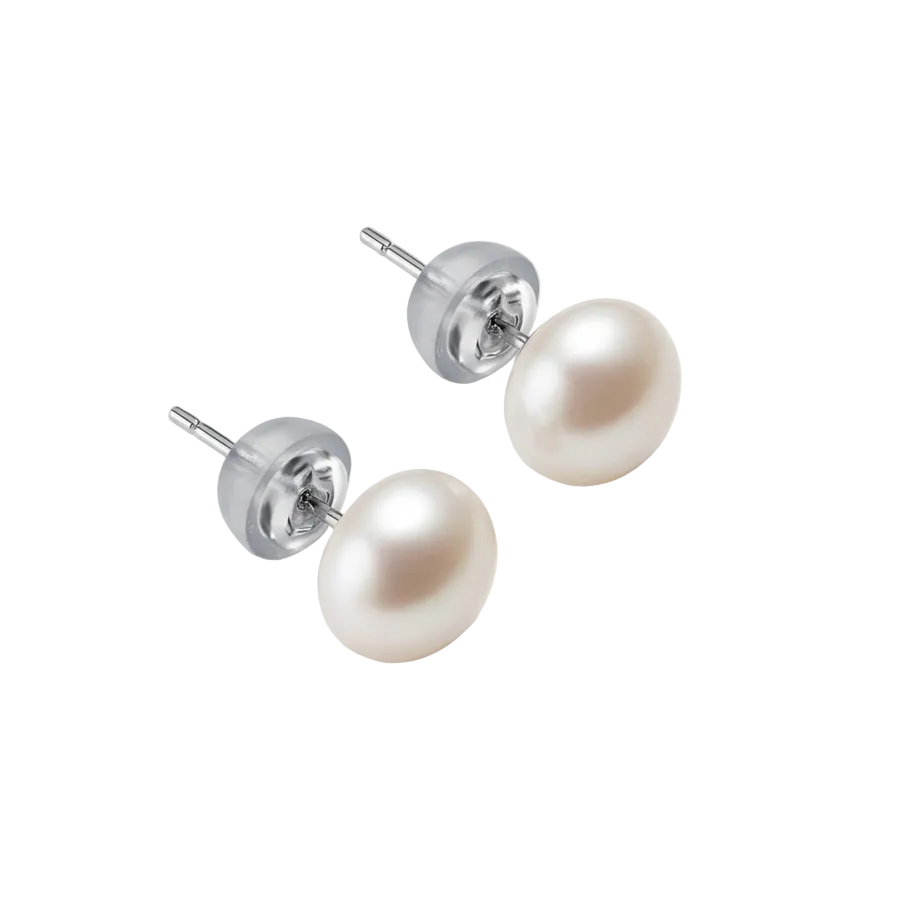 Pair of pearl earrings on a light beige background