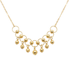 Gold necklace with circular links and spherical pendants on a transparent background