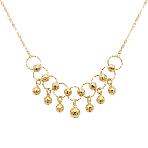 Gold necklace with circular links and spherical pendants on a transparent background