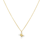 Gold and white star-shaped pendant on a chain against a white background