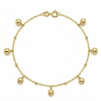 Gold bracelet with spherical charms on a white background