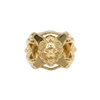 Gold ring with lion head design on a white background
