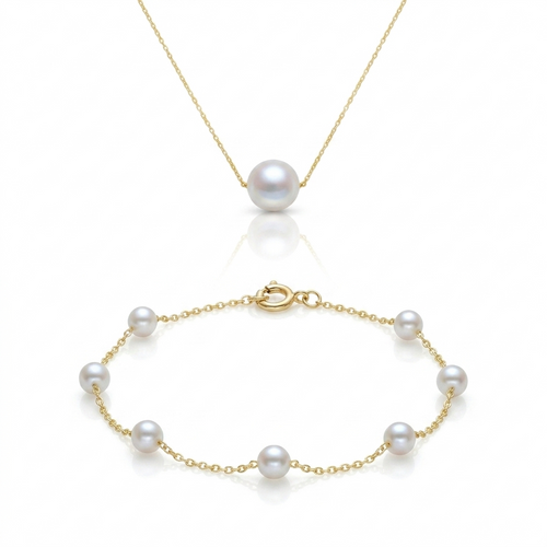 Gold bracelet with pearls on a white background