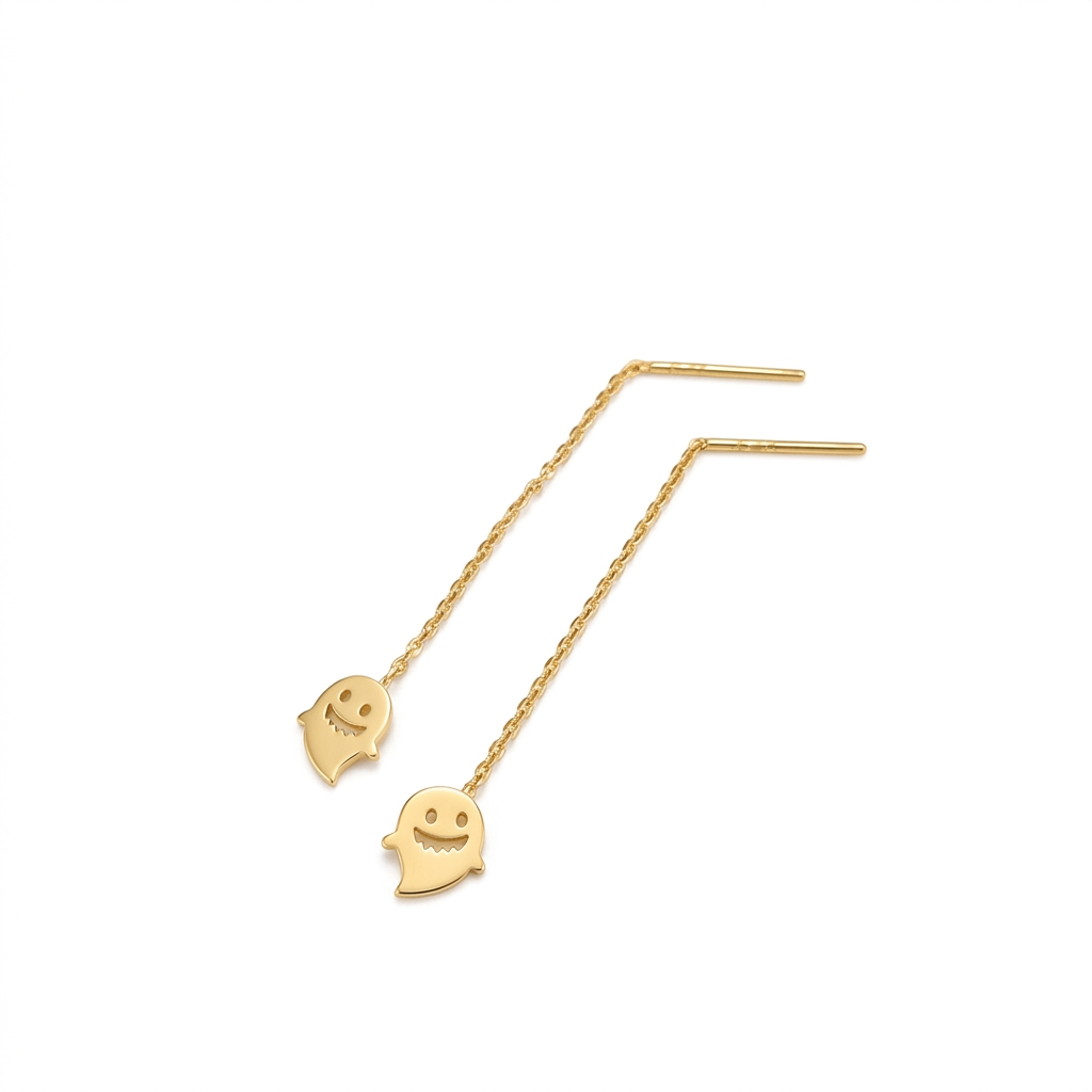 Gold smiley face earrings on a white background