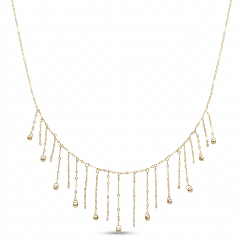 Gold necklace with dangling beads on a white background
