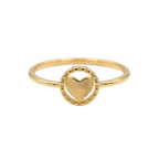 Gold ring with a heart design on a white background