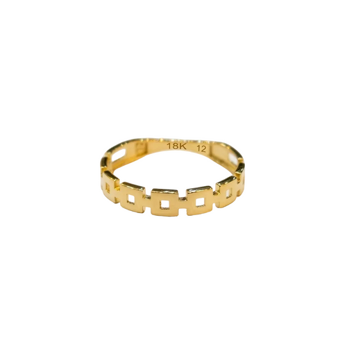 Gold ring with geometric design on a white background
