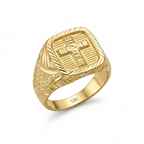 Gold ring with cross design on a white background