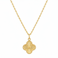 Gold necklace with a clover-shaped pendant on a white background