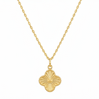 Gold necklace with a clover-shaped pendant on a white background