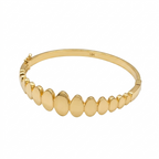Gold bracelet with round links on a white background