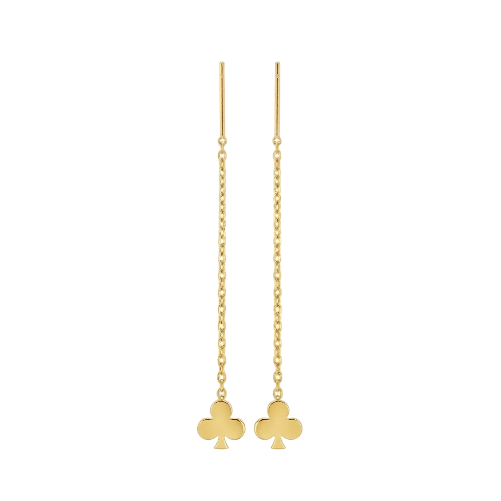 Gold clover-shaped earrings on thin chains against a white background