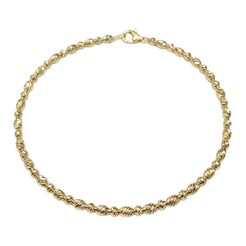 Gold chain bracelet on a white background