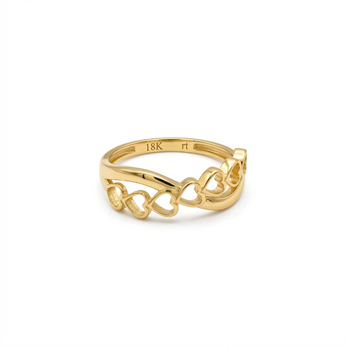 Gold ring with intricate design on a white background