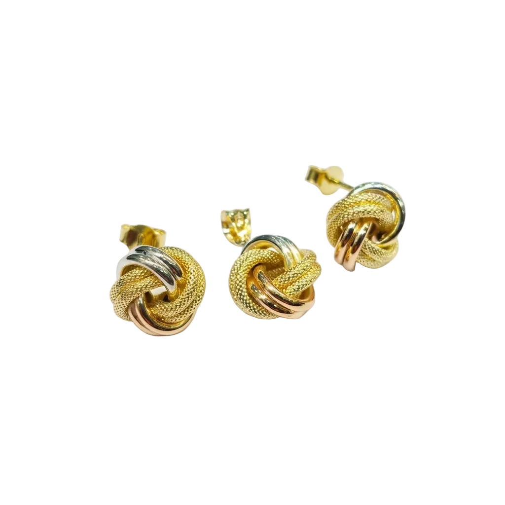 Gold knot earrings on a white background