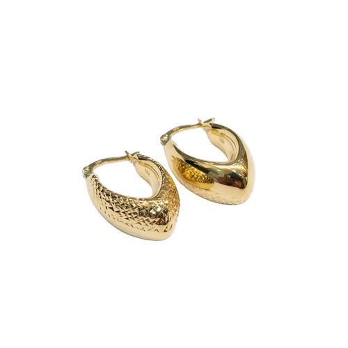 Gold hoop earrings on a white background