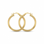 Gold hoop earrings on a white background