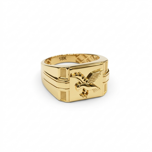 Gold ring with eagle emblem on a white background