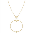 Gold necklace and bracelet set on a white background