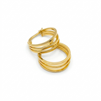 Gold hoop earrings on a white background