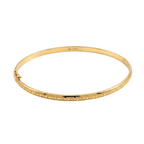 Gold bracelet with intricate design on a white background