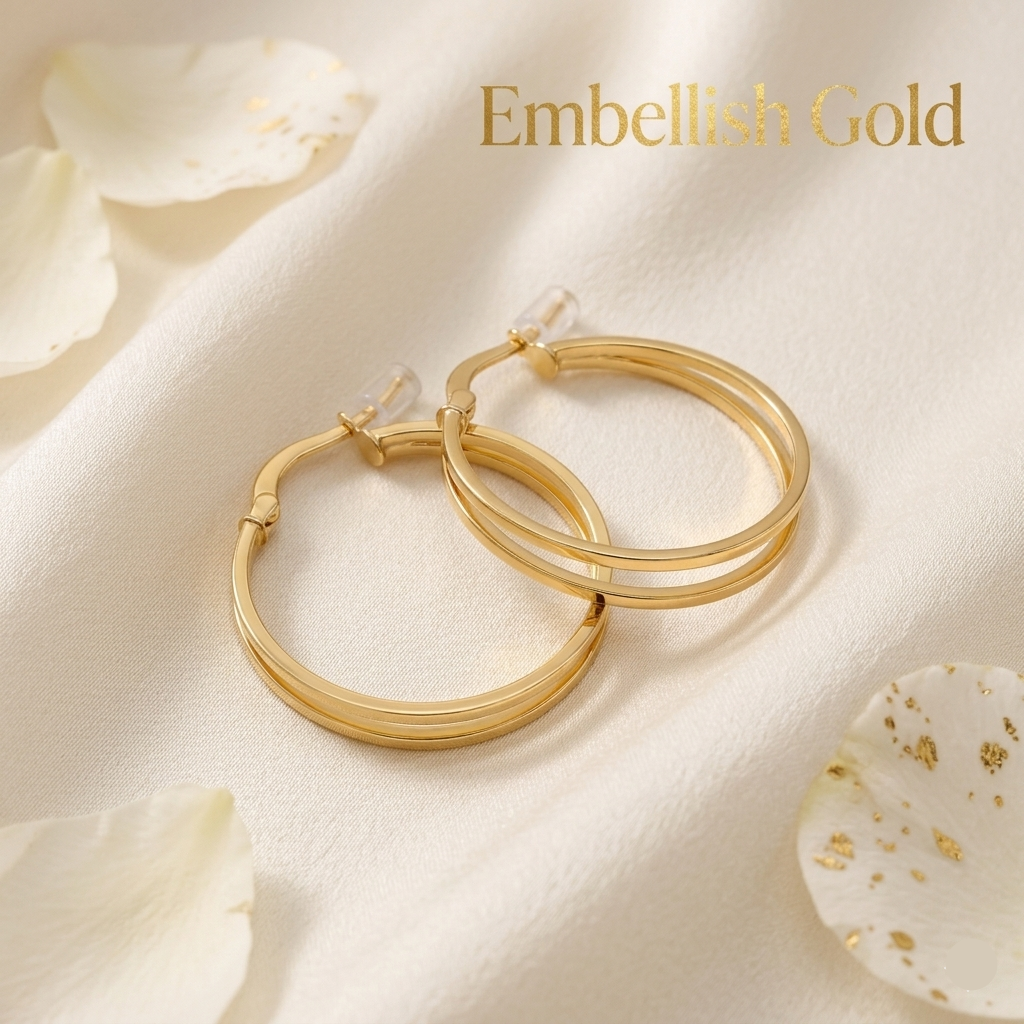 Gold hoop earrings on a soft beige fabric background with 'Embellish Gold' text.