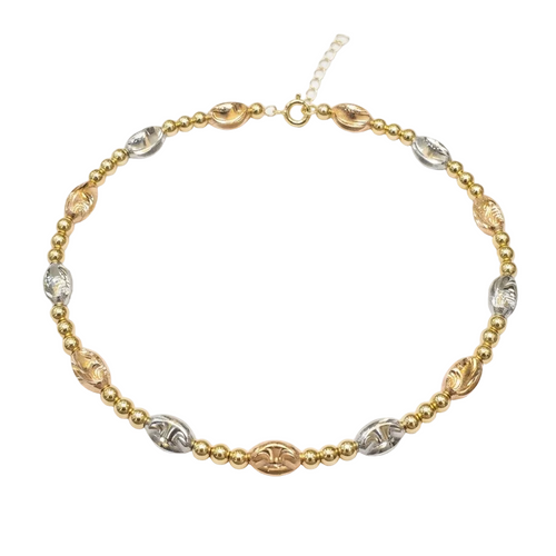 Gold and silver beaded necklace on a white background
