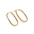 Gold hoop earrings on a white background
