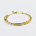 Gold bracelet on a white background